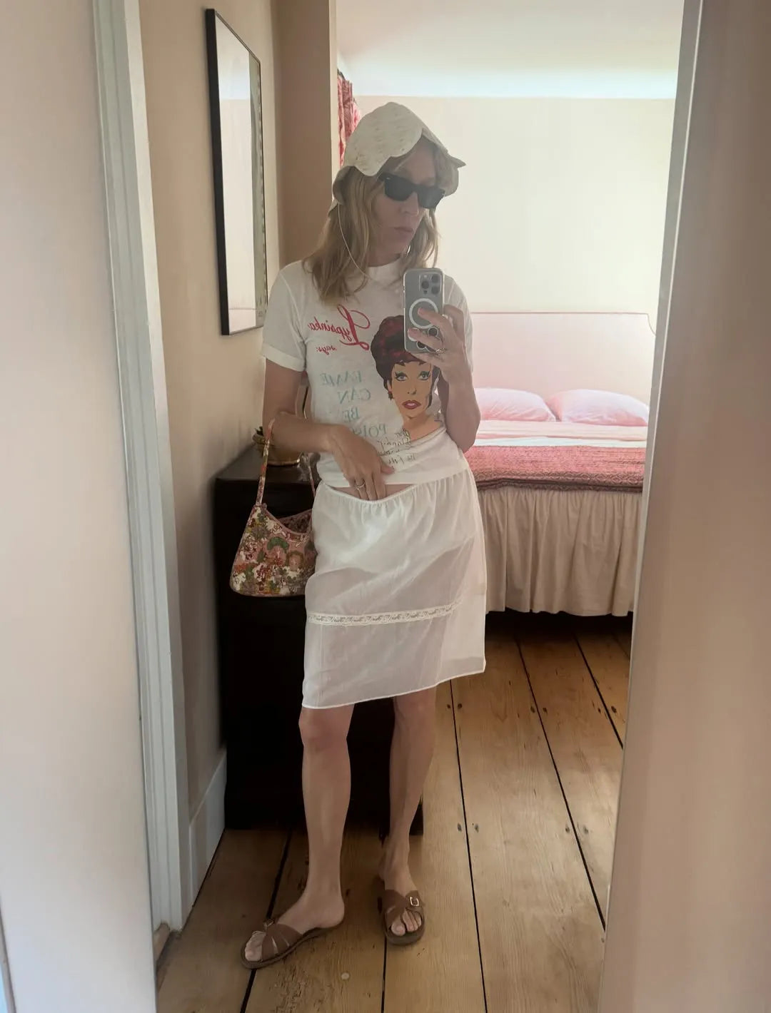 Chloe Sevigny wearing the Dawn Sharp Little House print Petal Bonnet reposted and featured in Vogue